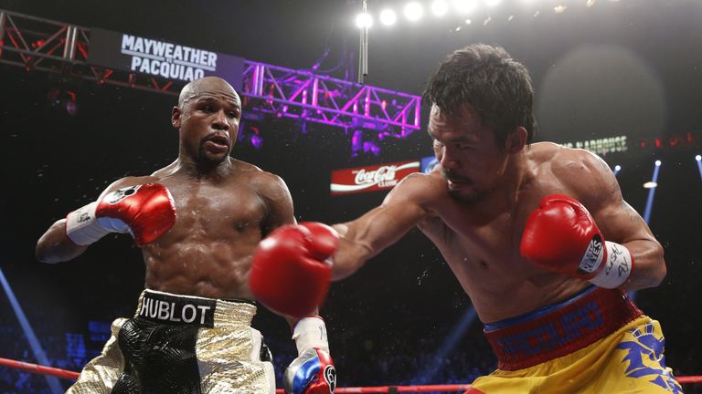 Floyd Mayweather exchanges punches with Manny Pacquiao