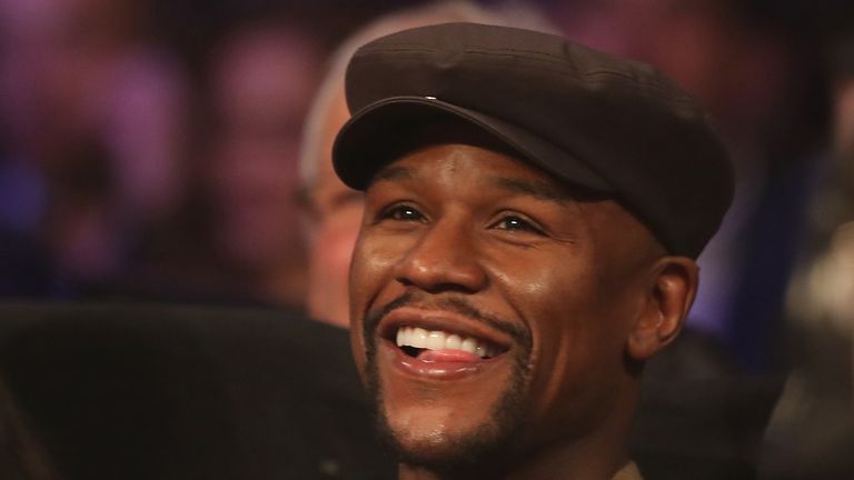 Floyd Mayweather Jr. watches ringside to see Manny Pacquiao beat Jessie Vargas