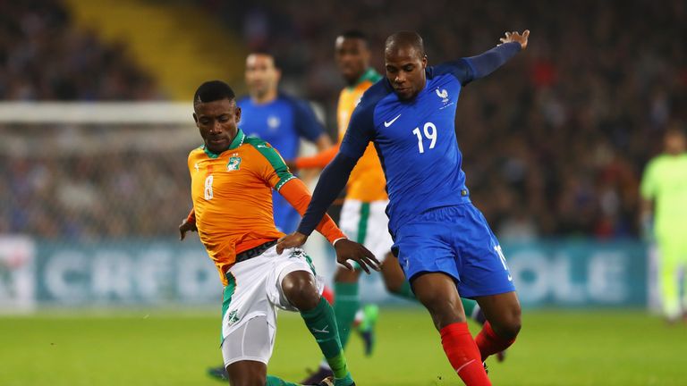Salomon Kalou of The Ivory Coast battles for the ball with Djibril Sidibe of France