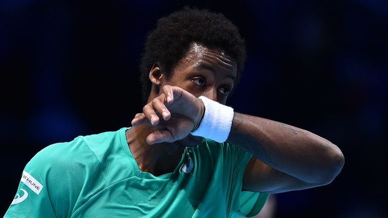 France's Gael Monfils reacts against Austria's Dominic Thiem during their round robin stage men's singles match on day three of the ATP World Tour Finals t