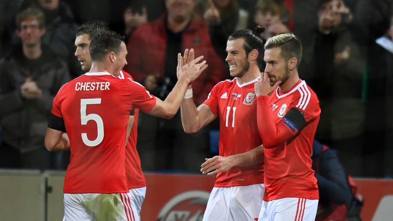 Wales' forward Gareth Bale (2nd R) celebrates with teammates after scoring the opening goal of the World Cup 2018 qualification match between Wales and Ser