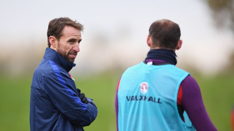 Wayne Rooney (R) trained with Gareth Southgate's (L) full squad despite playing for Manchester United on Sunday