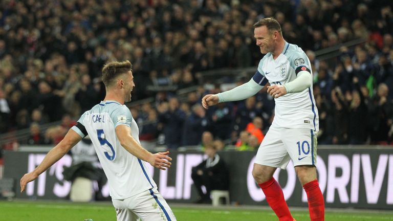 England's defender Gary Cahill (L) celebrates with England's striker Wayne Rooney after scoring their third goal during a World Cup 2018 qualification matc