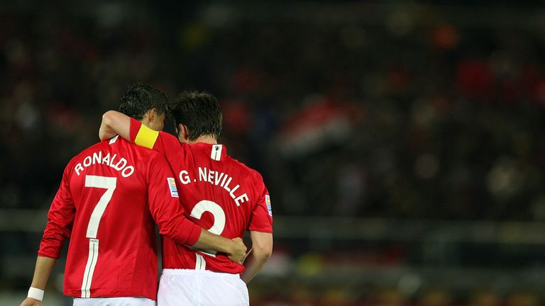 Cristiano Ronaldo of Manchester United celebrates scoring the second goal with his teammate Gary nevilleduring the FIFA Clu