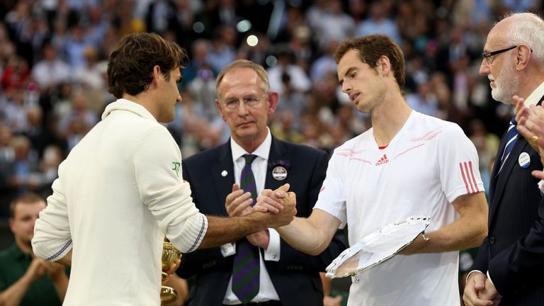 Winner Roger Federer of Switzerland and  runner up Andy Murray of Great Britain shake hands after their Gentlemen's Singles final
