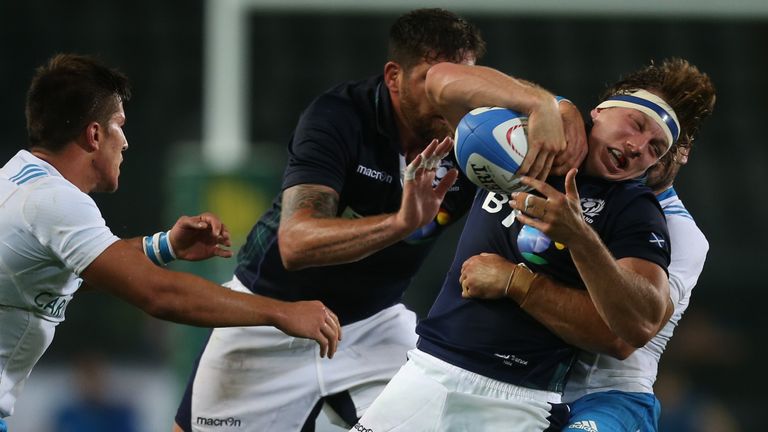 Scotland's Hamish Watson is tackled by Italian players during the Rugby World Cup Test match Italy Vs Scotland on August 22, 2015 at the "Olympic Stadium" 