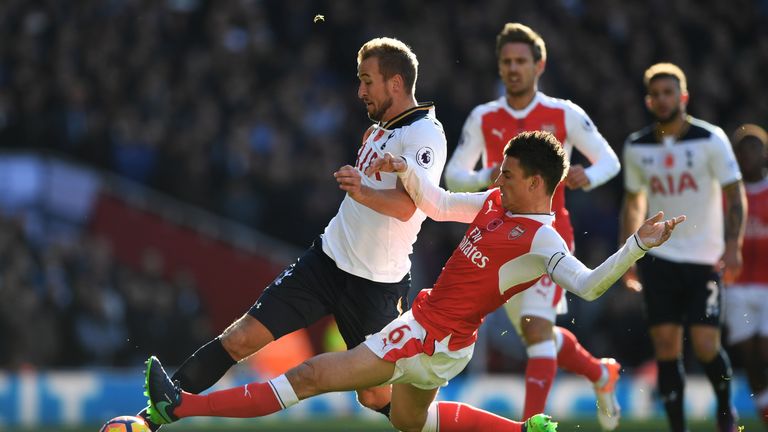 LONDON, ENGLAND - NOVEMBER 06:  Laurent Koscielny of Arsenal and Harry Kane of Tottenham Hotspur battle for possession during the Premier League match betw