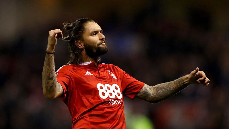 NOTTINGHAM, ENGLAND - OCTOBER 14:  Henry Lansbury of Forest celebrates scoring only to have the goal disallowed by Referee Jeremy Simpson after speaking wi