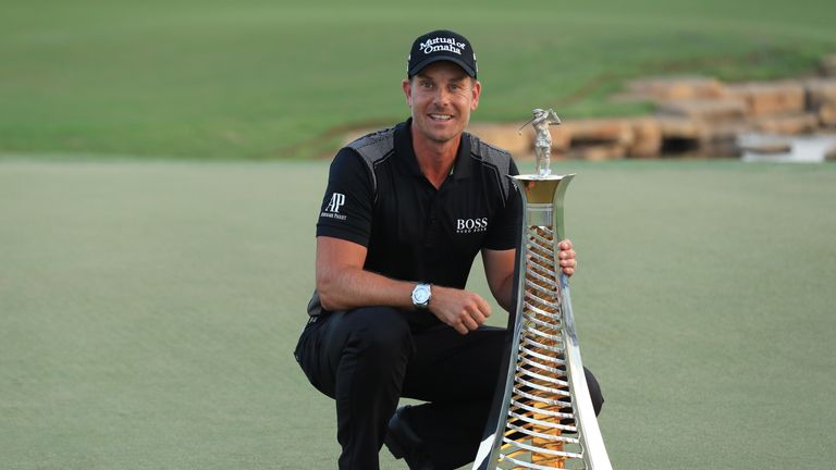 DUBAI, UNITED ARAB EMIRATES - NOVEMBER 20:  Henrik Stenson of Sweden poses with the Race to Dubai trophy during day four of the DP World Tour Championship 