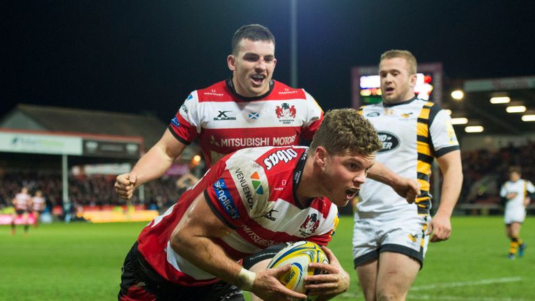 Henry Purdy of Gloucester scores a try 