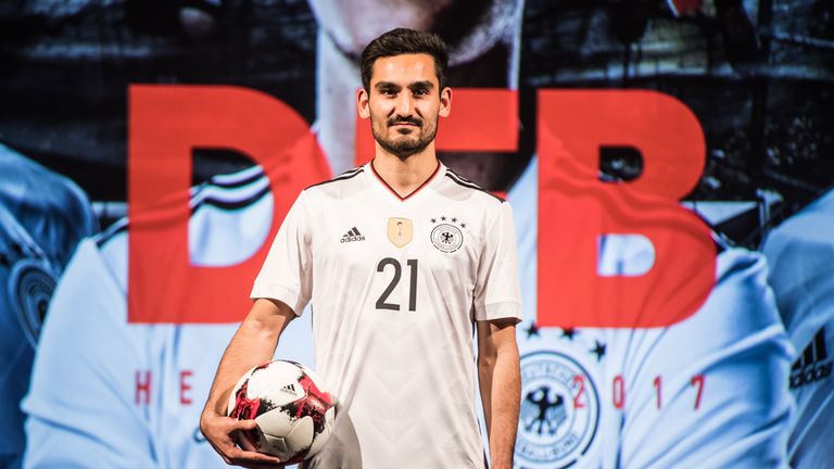 Ilkay Gundogan poses during the presentation of the new Germany home jersey