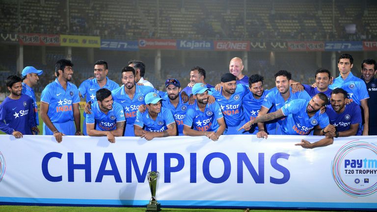 Indian cricket team poses with paytm champions Trophy  during the third T20 international match between India and Sri Lanka at the Dr. Y.S. Rajasekhara Red