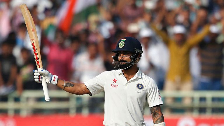 India's captain Virat Kohli raises his bat