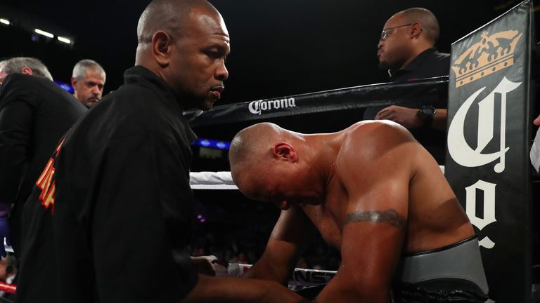 Trainer Roy Jones Jr. consoles Isaac Chilemba of Malawi after the stoppage of his light heavyweight fight against Oleksandr Gvozdyk.