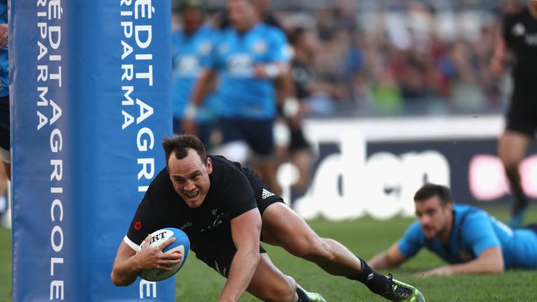 Israel Dagg of the New Zealand scores a try against Italy