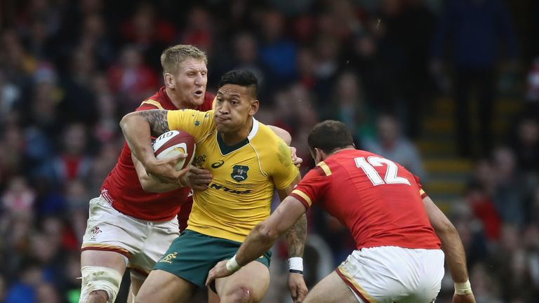 CARDIFF, WALES - NOVEMBER 05: Israel Folau of Australia is held by Bradley Davies (L) and Jamie Roberts during the International match between Wales and Au