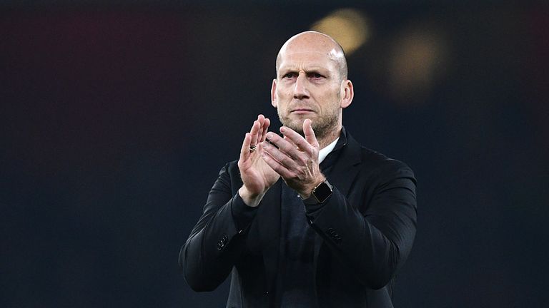 Reading's Dutch manager Jaap Stam applauds supporters after the EFL (English Football League) Cup fourth round match between Arsenal and Reading at The Emi
