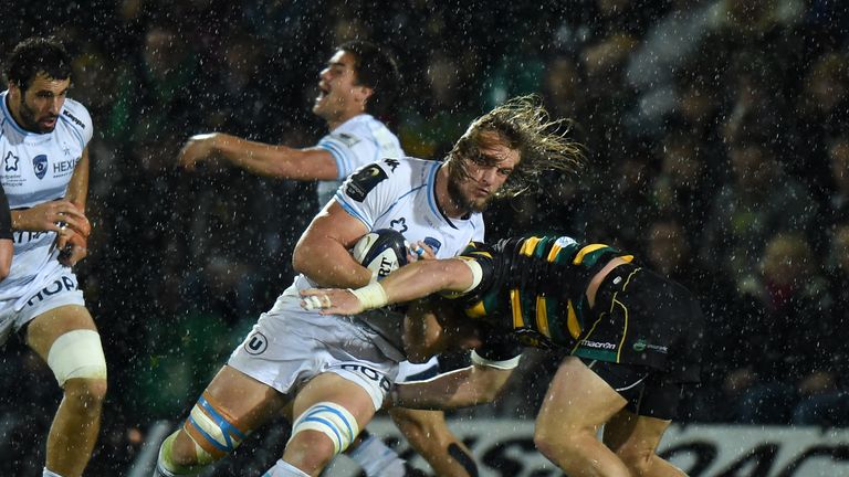 Mikey Haywood of Northampton Saints tackles Jacques Du Plessisof Montpellier during the European Rugby Champions Cup October 2016