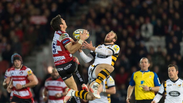 James Hook (L) and Dan Robson challenge for the ball