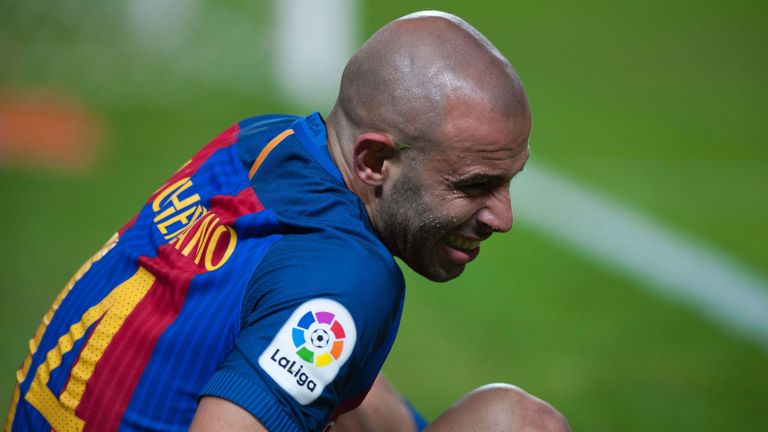 Barcelona's Argentinian midfielder Javier Mascherano reacts as he sits on the pitch during the Spanish league football match Sevilla FC vs FC Barcelona at 