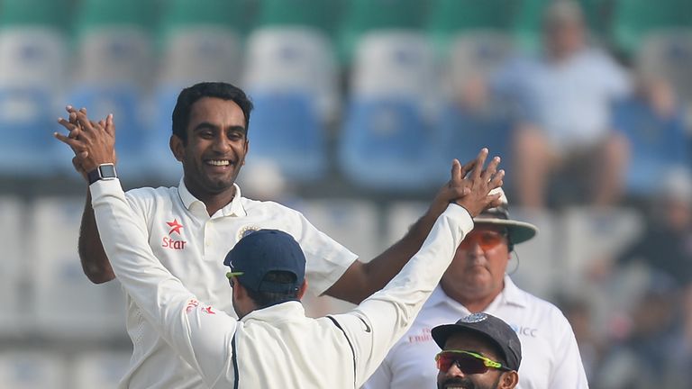 India bowler Jayant Yadav (L) celebrates with his teammates after he dismissed England batsman Jos Buttler on the fourth day of the third Test cricket matc