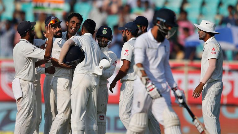 India's Jayant Yadav, third left without cap, celebrates with teammates the dismissal of England's Moeen Ali, second right, on the second day of their seco