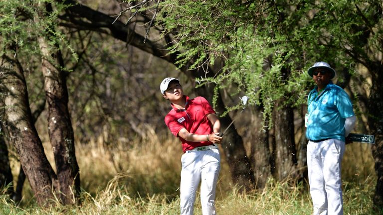 Jeunghun Wang clung onto second place despite an erratic 75