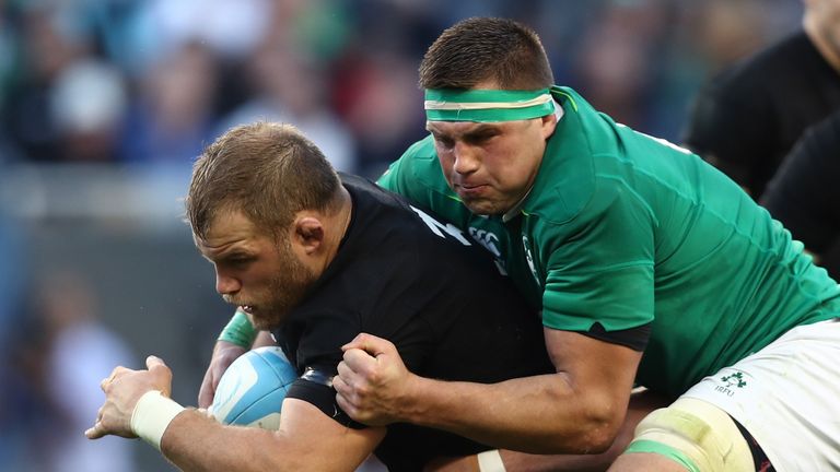 Joe Moody of New Zealand is hauled down by CJ Stander of Ireland