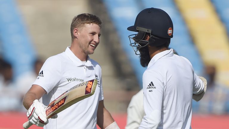NB: This was downloaded as part of our deal with AFP. Not for commercial use. Joe Root (L) celebrates with Moeen Ali after scoring a century