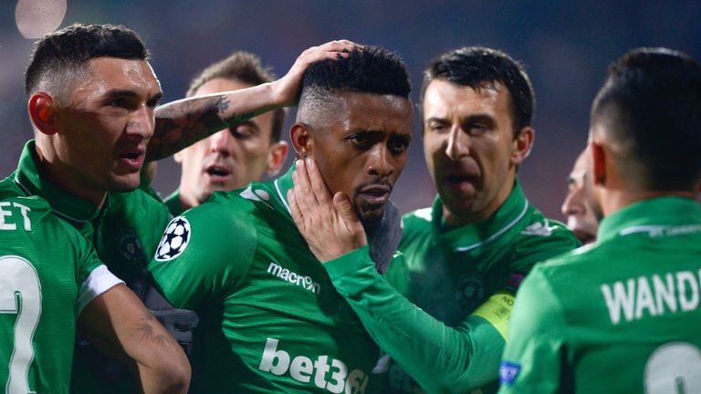 Ludogorets's Midfielder Jonathan Cafu (C) celebrates with teammates after scoring a goal during the UEFA Champions League Group A football match between PF