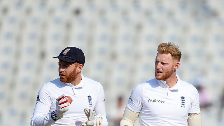 England bowler Ben Stokes (R) and wicketkeeper Jonathan Bairstow walk back at the close of India's first innings on the third day of the third Test match b