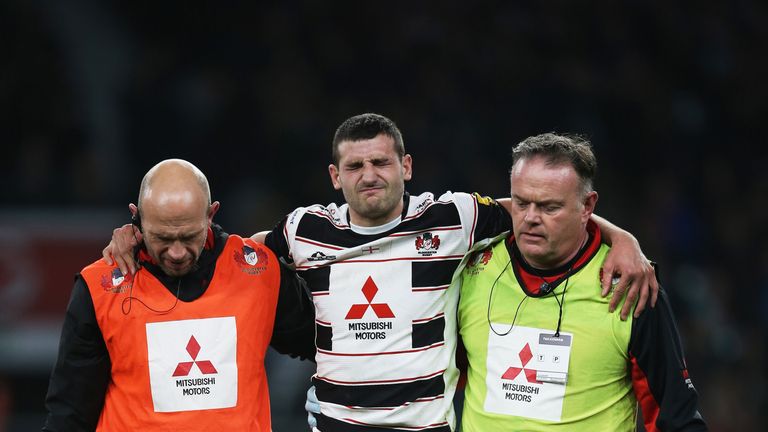 Jonny May leaves the field injured during the Aviva Premiership match between Harlequins and Gloucester