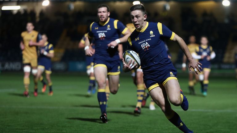 WORCESTER, ENGLAND - NOVEMBER 04:  Josh Adams of Worcester breaks with the ball to score the first try during the Anglo-Welsh Cup match between Worcester W