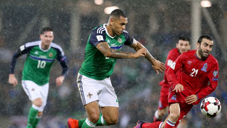 Northern Ireland's Josh Magennis (centre) and Azerbaijan's Arif Dasdamirov (right) battle for the ball during the 2018 FIFA World Cup qualifying match