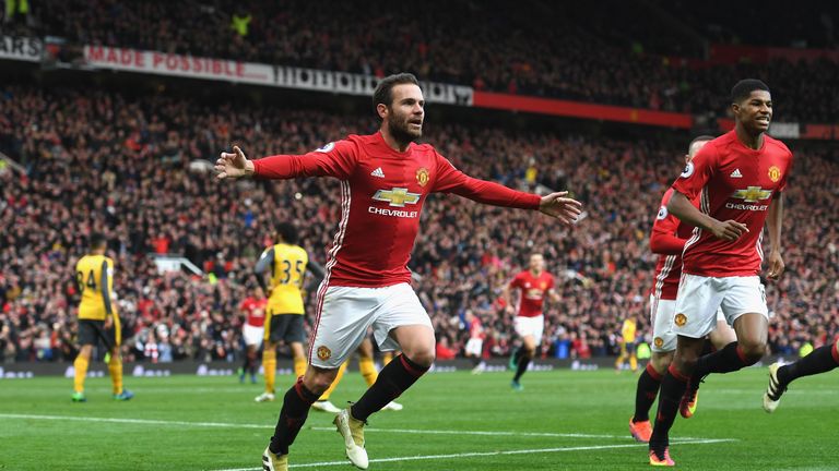 Juan Mata celebrates after opening the scoring for Man United against Arsenal