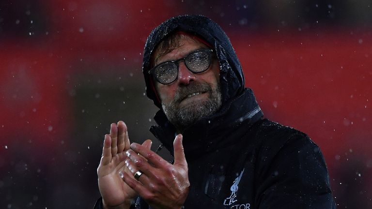 Rain covers the glasses of Liverpool's German manager Jurgen Klopp as he applauds the fans following the English Premier League football match between Sout