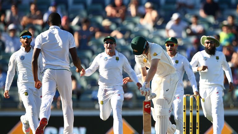 Adam Voges slumps at the crease after being dismissed by Kagiso Rabada in Perth