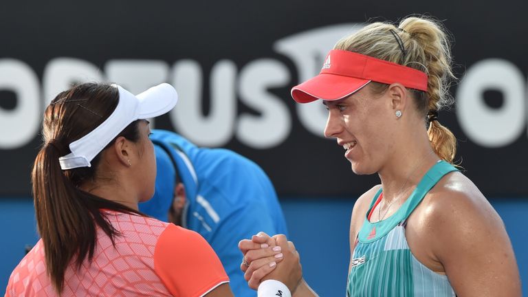 Germany's Angelique Kerber (R) shakes hands with Japan's Misaki Doi after Kerber won their women's singles match on day two of the 2016 Australian Open ten