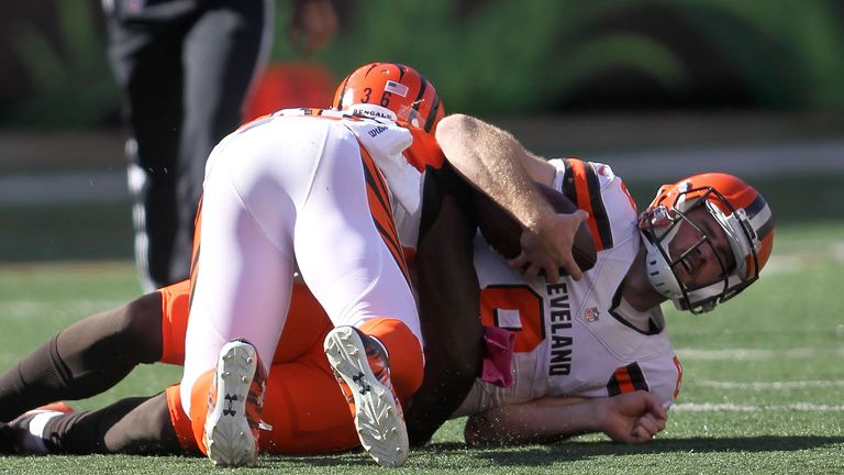 CINCINNATI, OH - OCTOBER 23:  Kevin Hogan #8 of the Cleveland Browns is tackled by Shawn Williams #36 of the Cincinnati Bengals during the third quarter at