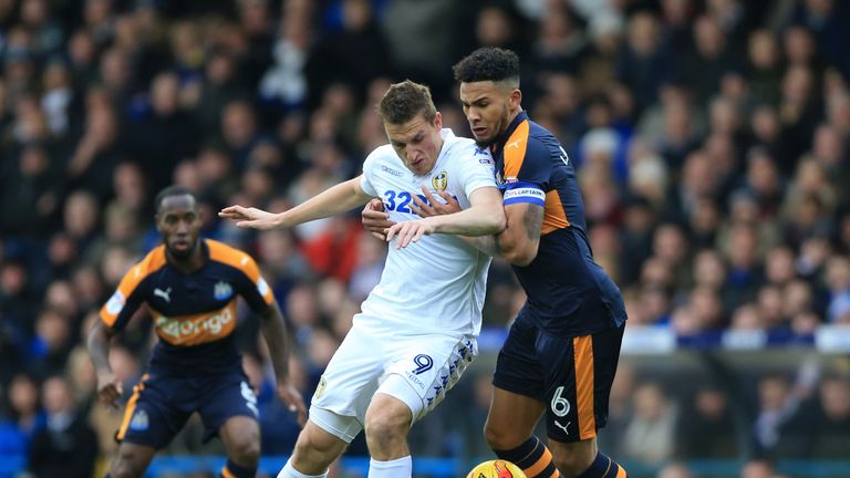 Leeds United's Chris Wood (left) and Newcastle United's Jamaal Lascelles battle for the ball during the Sky Bet Championship match at Craven Cottage, Londo