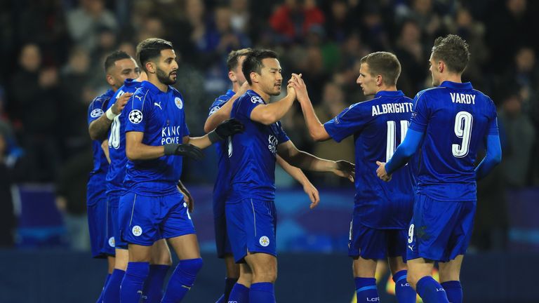 LEICESTER, ENGLAND - NOVEMBER 22: Riyad Mahrez of Leicester City celebrates scoring his sides second goal with team mates during the UEFA Champions League 