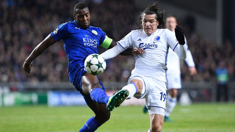 Leicester City's Jamaican defender Wes Morgan (L) vies with FC Copenhagen's Paraguayan forward Federico Santander during the UEFA Champions League group G 
