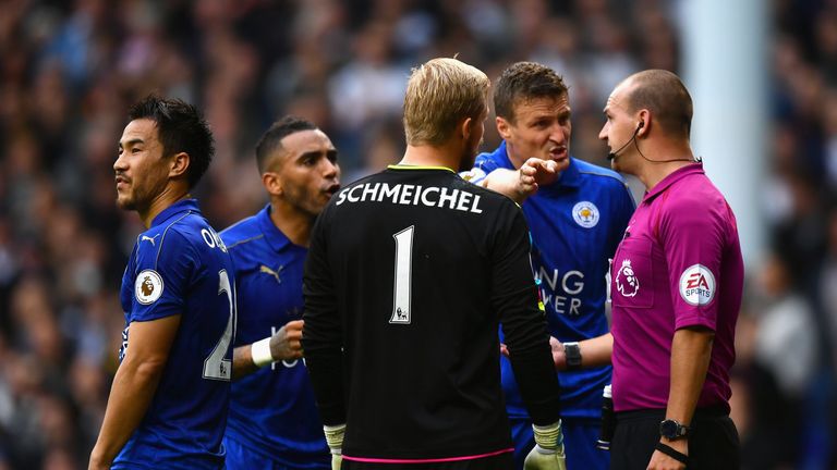 LONDON, ENGLAND - OCTOBER 29: Robert Huth (2nd R) of Leicester City protests to referee Robert Madley (1st R) against his penalty dicision during the Premi