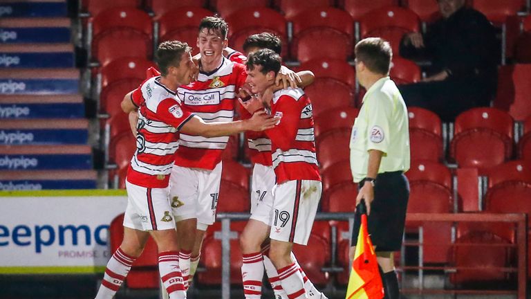 Doncaster Rovers' Liam Mandeville (right) celebrates after scoring