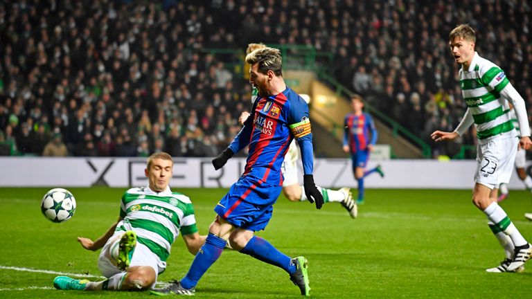 Barcelona's Lionel Messi gets a shot away under pressure from Celtic's Jozo Simunovic