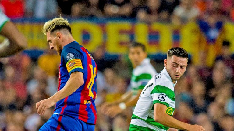 Celtic's Patrick Roberts (right) looks to stop Lionel Messi at the Nou Camp in September
