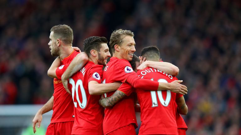 Philippe Coutinho of Liverpool celebrates with team-mates after scoring