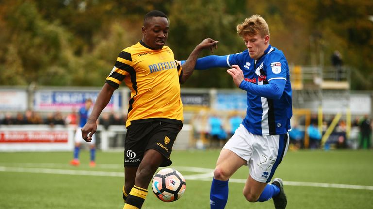 Jamar Loza of Maidstone United battles with Andy Cannon of Rochdale