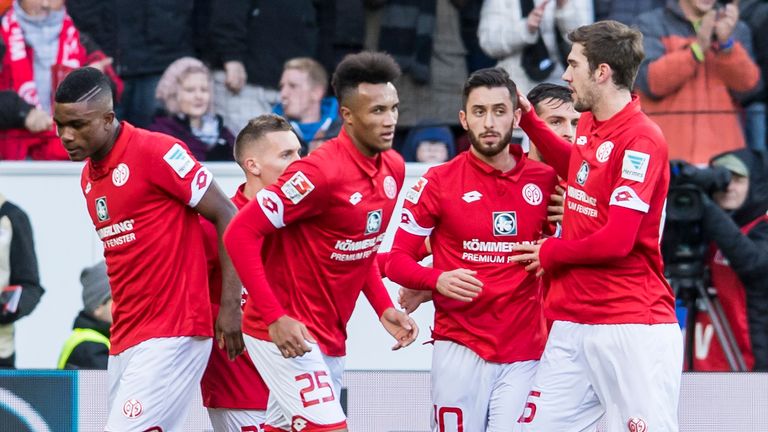 MAINZ, GERMANY - NOVEMBER 19: Yunus Malli of Mainz 05 celebrates the second goal for his team with Jean-Philippe Gbamin of Mainz 05 and Jhon Cordoba of Mai