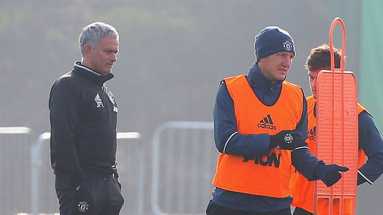 Manchester United manager Jose Mourinho puts Bastian Schweinsteiger through his paces in training